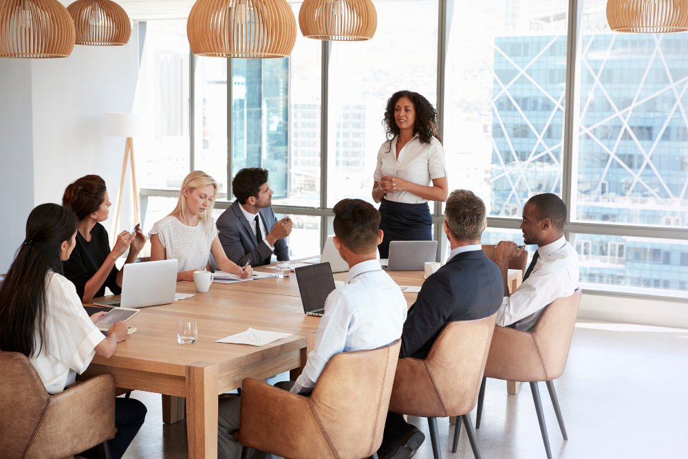 A woman holding a meeting in an office setting