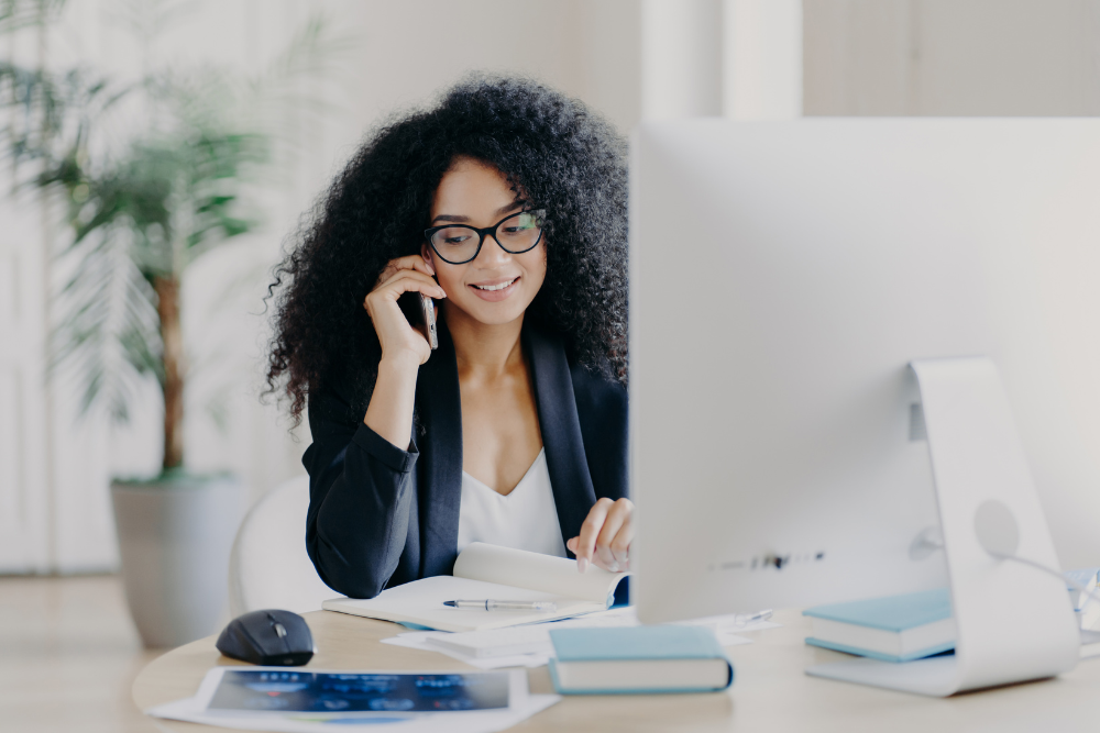 A woman at work taking a phone call