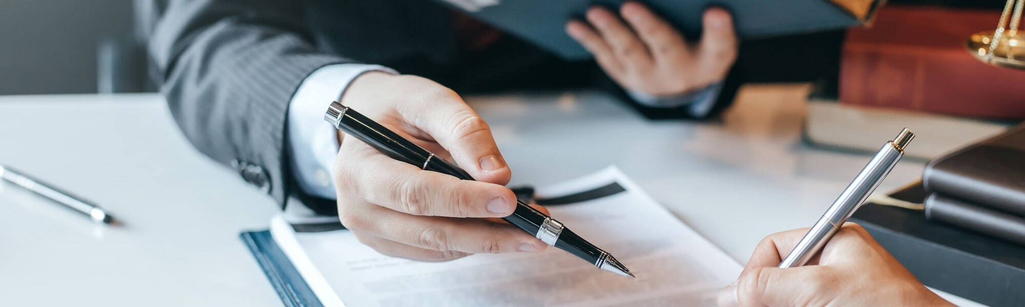 Hand holding a ball point pen