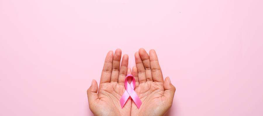 Palms of hands with a pink Breast Cancer ribbon